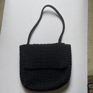 Carrie Forbes, New York designer in the 80’s. Black bag, 11” tall x 13” wide.